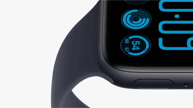 Close-up of a Midnight Apple Watch SE 3 showing the side button, the dark band and part of a blue watch face