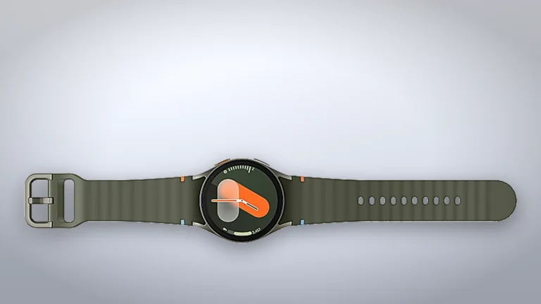 Samsung Galaxy Watch7 40 mm lying flat with its green sport band fully open, buckle on the left